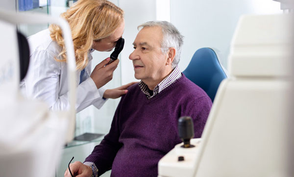 Eye doctor examining a patient