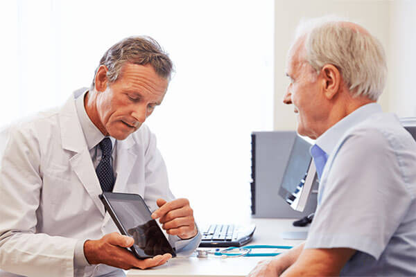 Eye doctor talking with patient about glaucoma